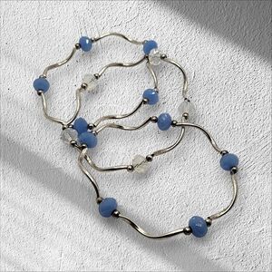 BRACELETS SET OF 3 BLUE AND CLEAR BEADS WITH METAL SPIRAL BUGAL BEADS